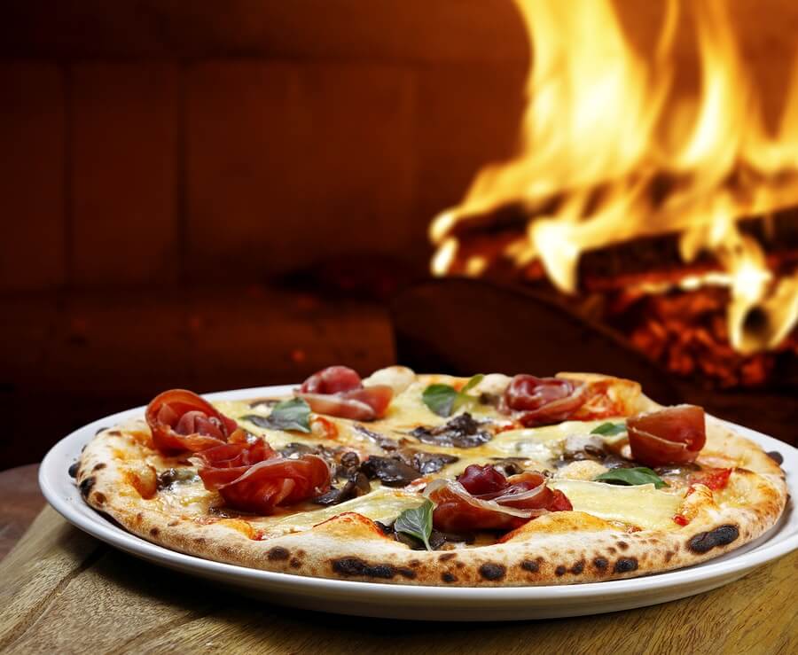 freshly prepared wood-fired pizza in our oven in Kent